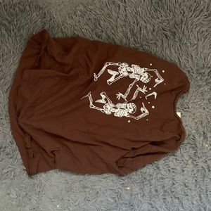 Brown t with dancing skelly